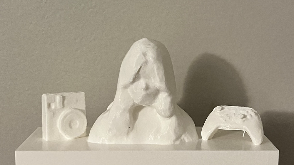 Polaroid represents that I like to take photographs and record my life when going out with my friends, gamepad meant that I like to play games, which is also one of my habit. From this model, I wish people can know what I like to do and what kind of person am I.