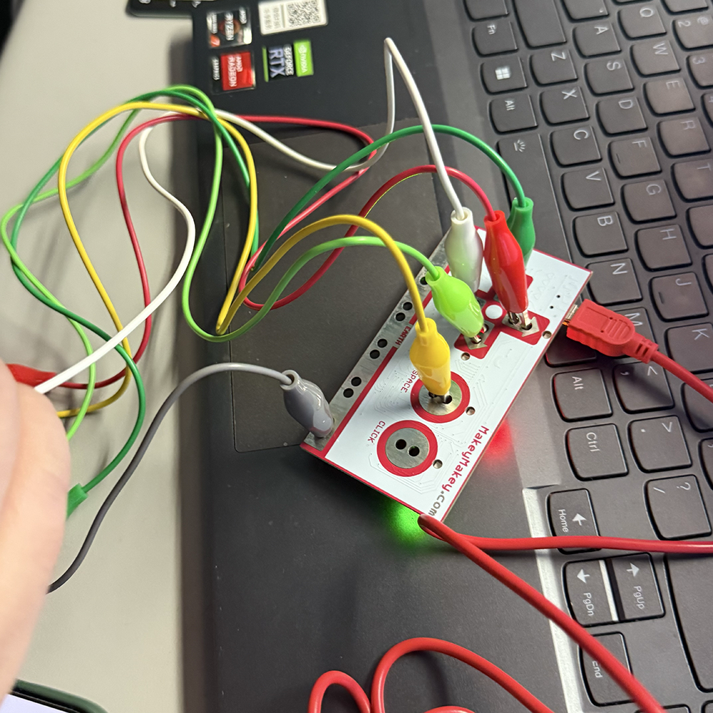 Adding new connection lines with MakeyMakey and other objects, so we can control the imageries through the connections.